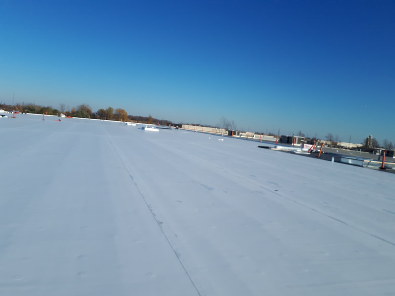 Aerial photo of Toyota Boshoku's commercial flat roof located in Woodstock, Ontario