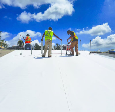 Photo of Alliance Roofing workers on the Boler Mountain Ski Chalet roof