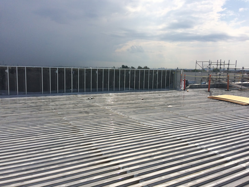 Photo of a new steel deck roof under construction
